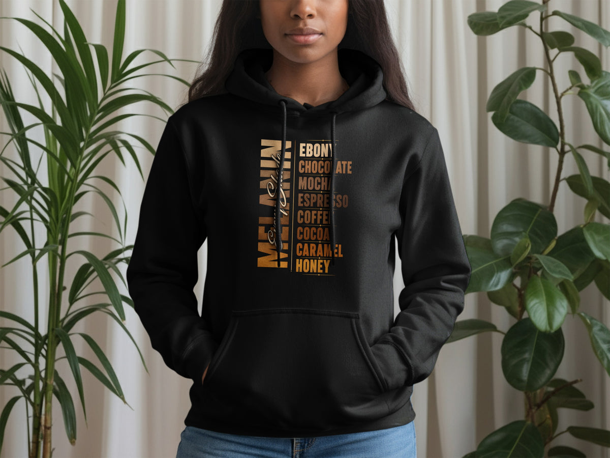 Black hoodie with "Melanin" and shades of brown text: Ebony, Chocolate, Mocha, Espresso, Coffee, Cocoa, Caramel, Honey.