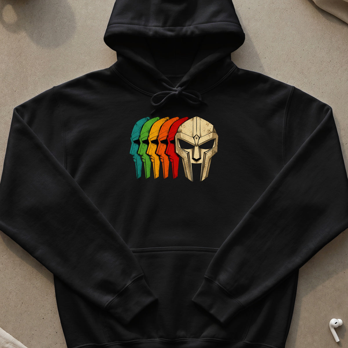 Black hoodie with a retro graphic of a masked face in rainbow colors.