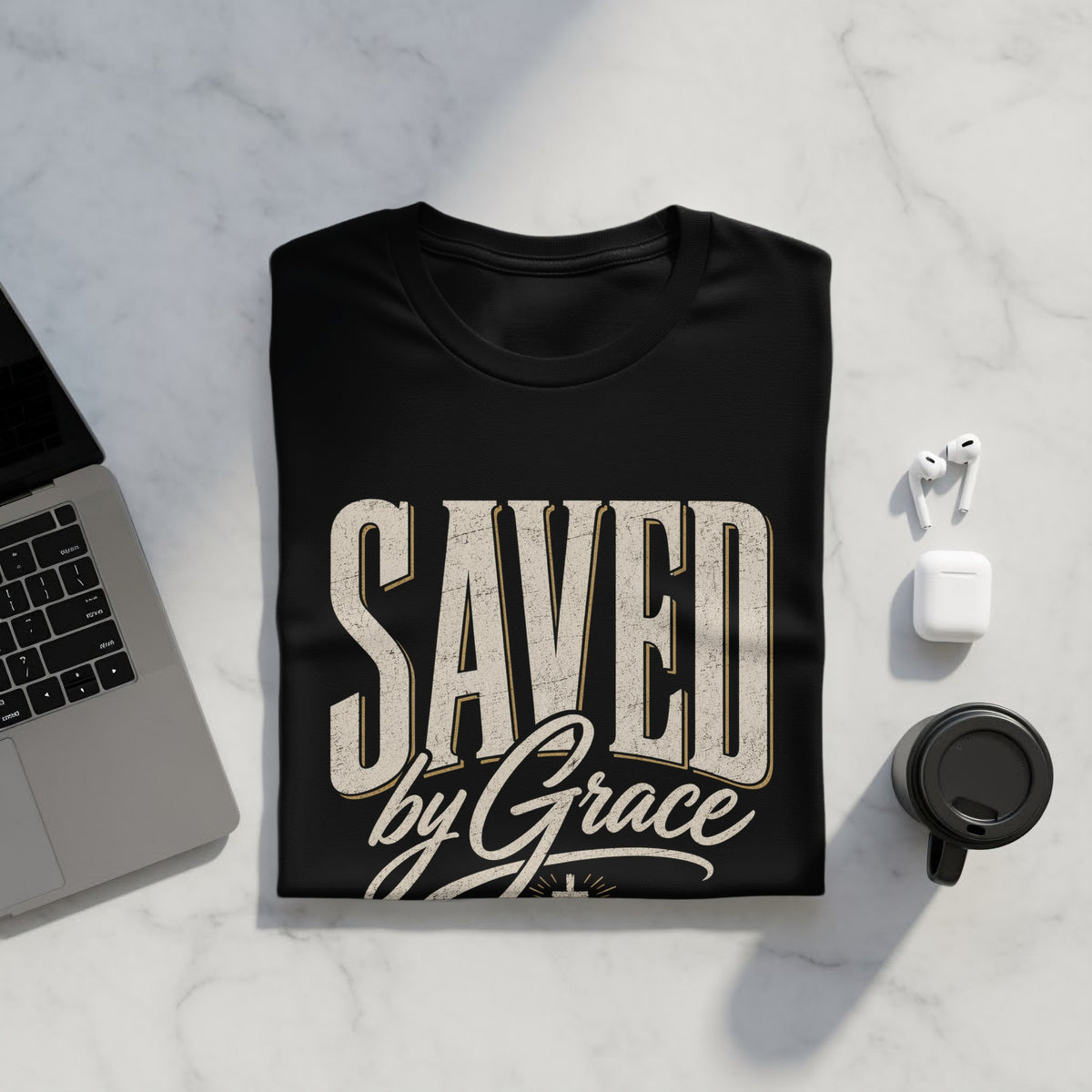 Black t-shirt with distressed text "SAVED by Grace" and a cross.