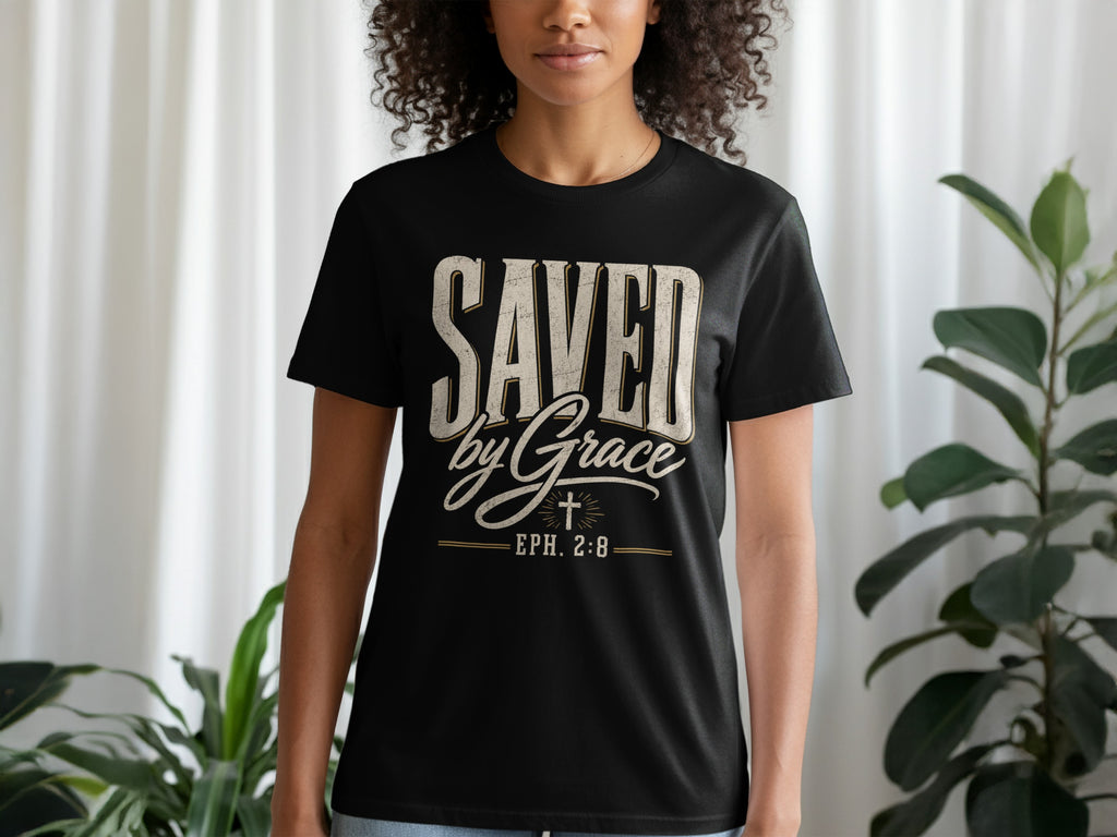 Black t-shirt with "SAVED by Grace EPH. 2:8" text and cross graphic.