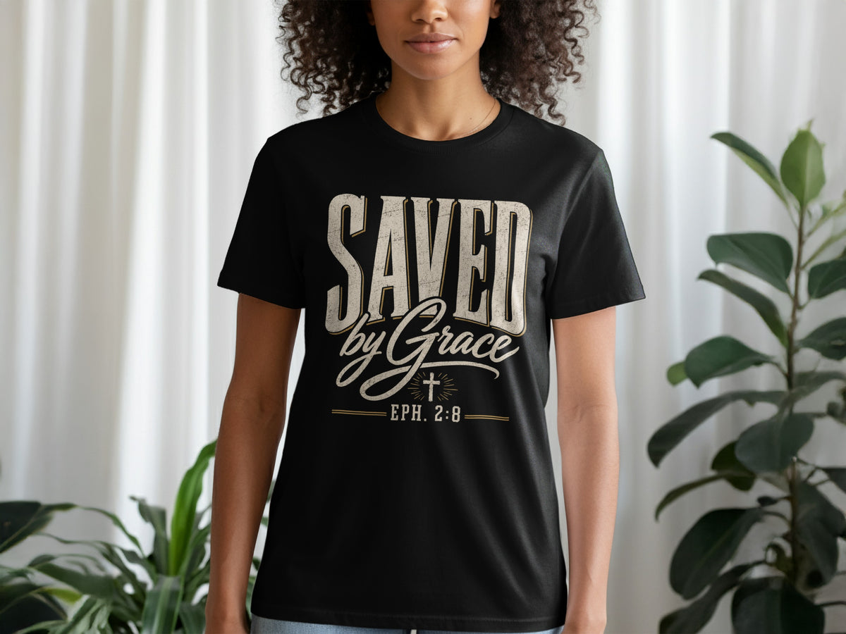 Black t-shirt with "SAVED by Grace EPH. 2:8" text and cross graphic.