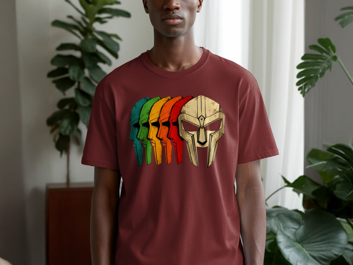 Maroon t-shirt with a row of colorful, stylized helmets graphic.