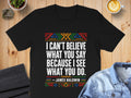 Black t-shirt with James Baldwin quote: "I can't believe what you say because I see what you do."