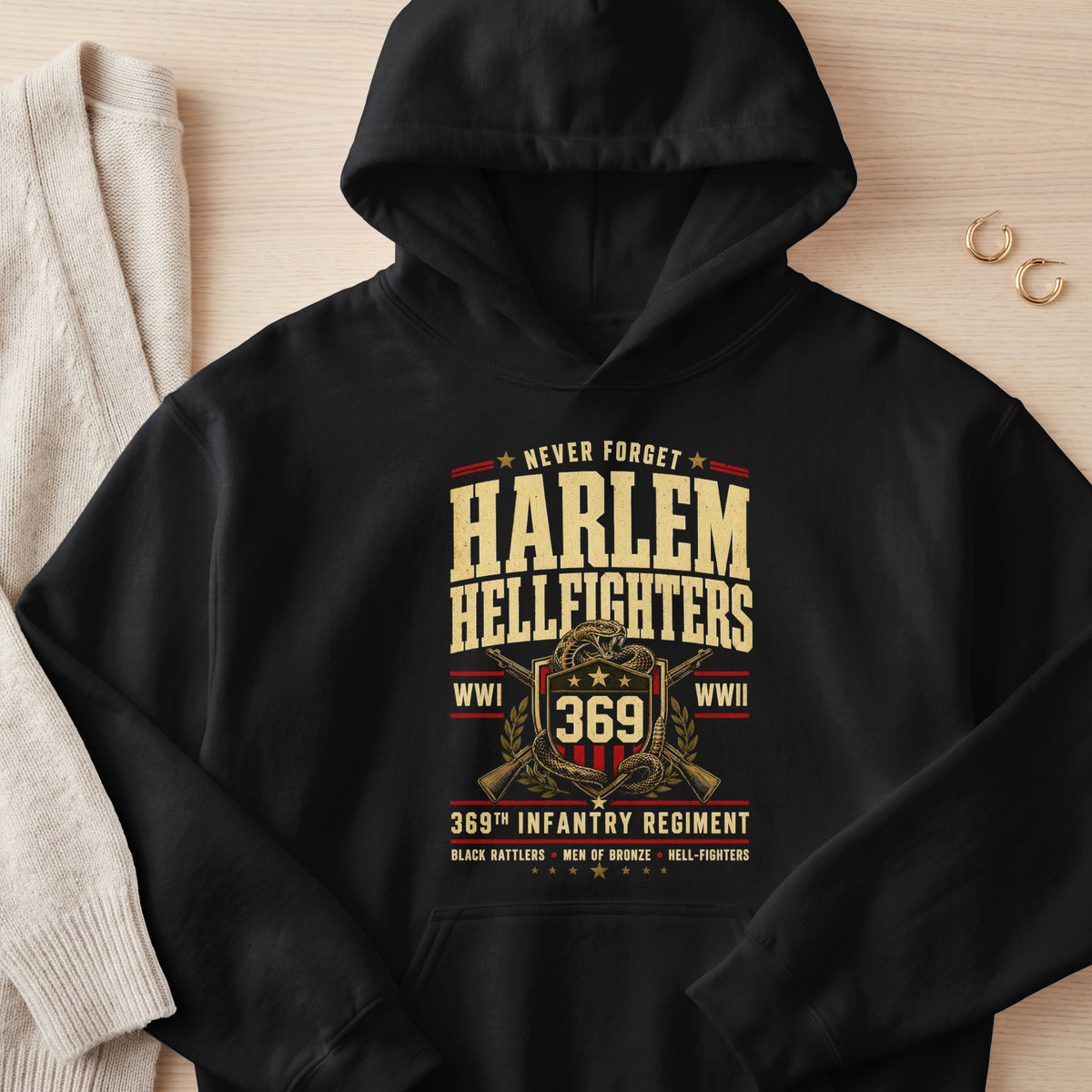 Black hoodie with Harlem Hellfighters 369th Infantry Regiment graphic.