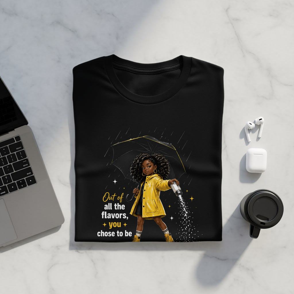 Black t-shirt with graphic of girl in yellow coat holding salt shaker, with text "Out of all the flavors, you chose to be."
