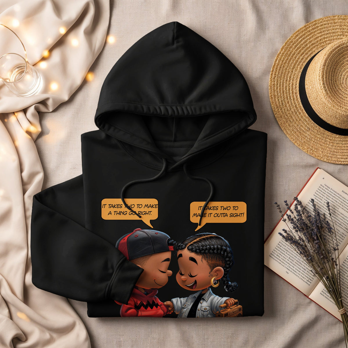 Black hoodie with cartoon children and text: "It takes two to make a thing go right."
