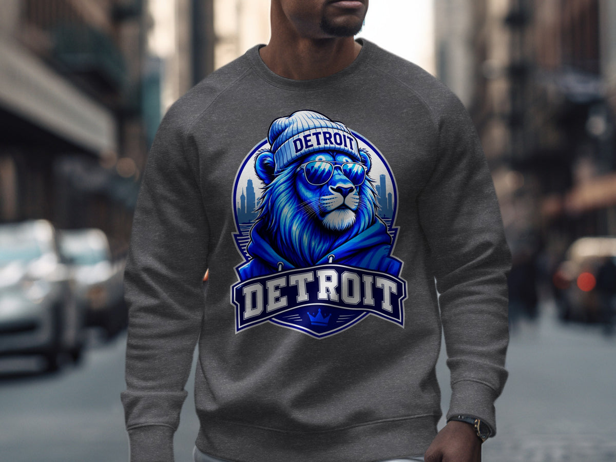 Grey crewneck sweatshirt with a blue lion graphic wearing sunglasses and a beanie, "DETROIT" text.