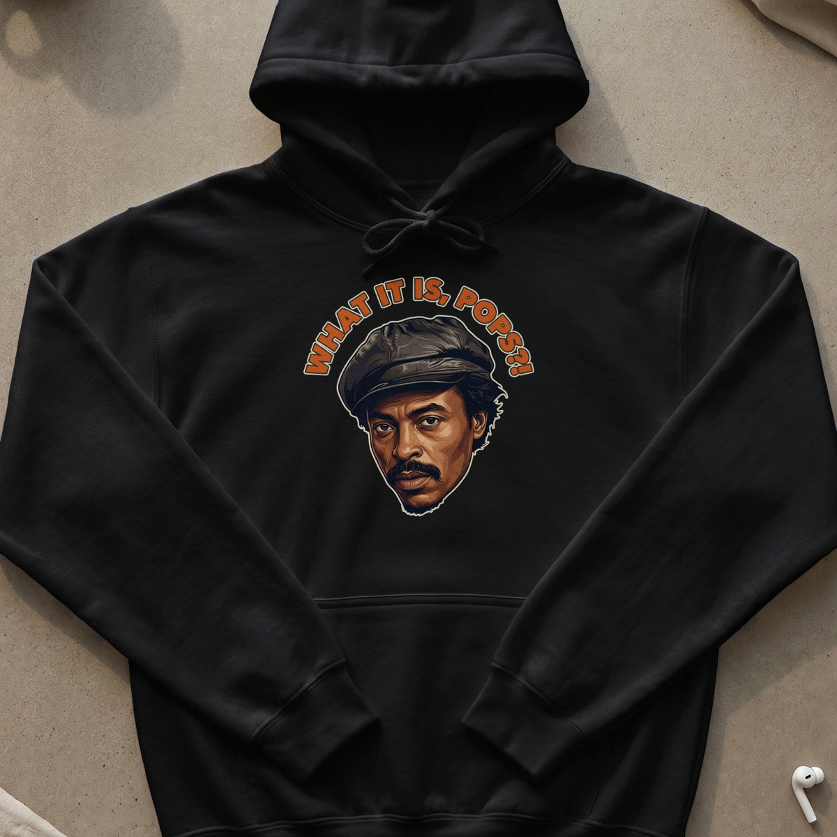 Black hoodie with a portrait and "WHAT IT IS, POPS?!" text.